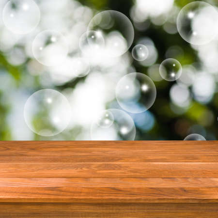 wooden table on green background close upの写真素材