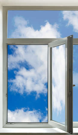 Open window  and sky against a white wallの写真素材