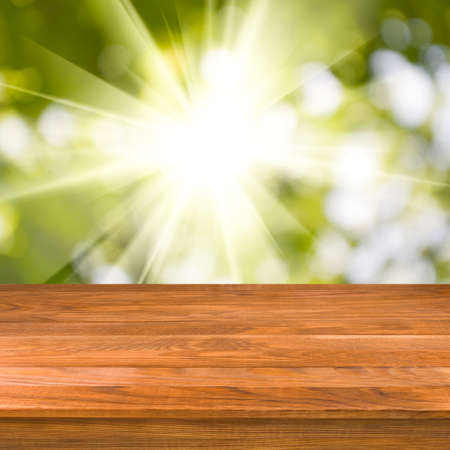 Image of wooden table on green backgroundの写真素材
