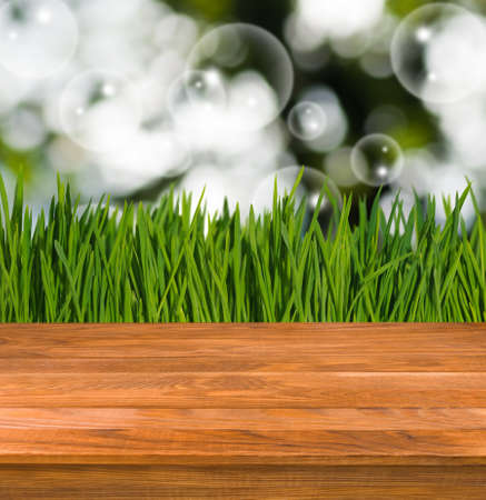 Image of wooden board on grass backgroundの写真素材