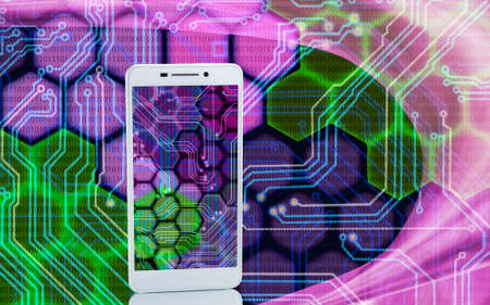 Image of smartphones on techno background close upの写真素材