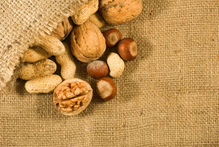 Big walnuts in a sack close-up.
Ripe nuts on a table.
Beneficial for health nuts, peanuts and walnutsの写真素材
