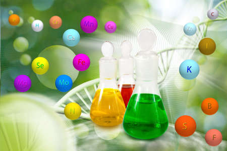 Image of laboratory glassware and balls with minerals on DNA strand  background.