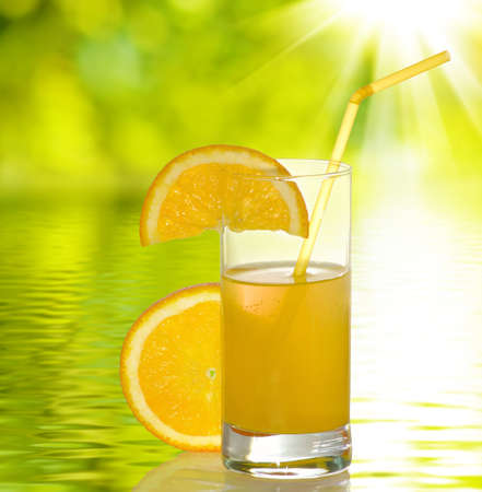 image of orange juice on a white background on water backgroundの写真素材