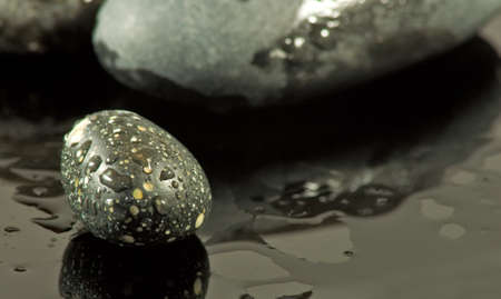 image of rock on the water closeup