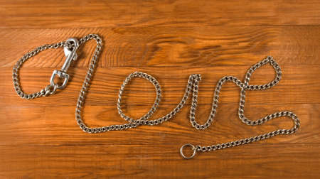 image of metal carabiner on the wooden tableの写真素材