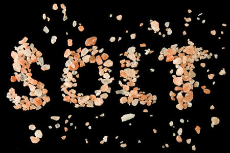 image of pink salt on black background closeupの写真素材