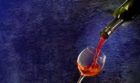 Isolated image of bottle and glass with wine close up