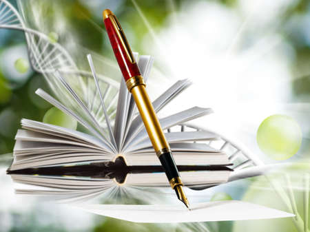 Image of book and pens on abstract backgroundの写真素材