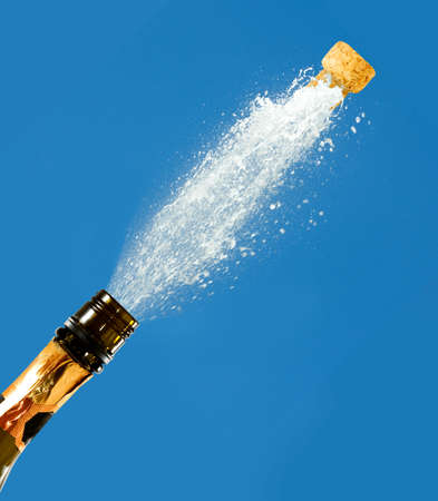 a bottle of champagne on a blue background