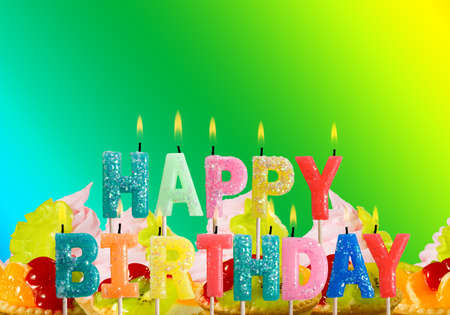 Image of congratulatory candles on a green backgroundの写真素材