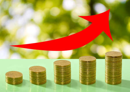 coins and arrows on a green backgroundbusiness subjects