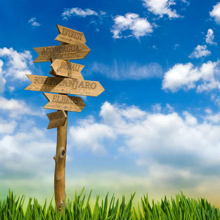 wooden direction signs mountains
title against the skyの写真素材