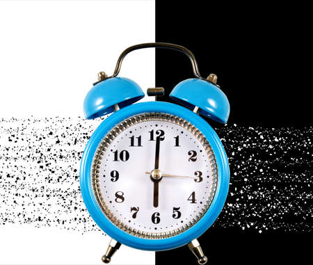 alarm clock as a symbol of the morning awakening on black and white background