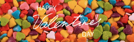 Happy Valentine's Day on a background with stylized multi-colored hearts.の写真素材