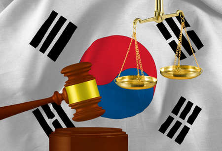 The image of the judge's gavel and scales against the background of the flag of the Republic of Korea. 3D- imageの写真素材