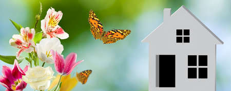 3d-image of a stylized house on the background of a natural landscapeの写真素材