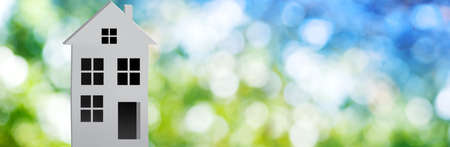 3d-image of a stylized house on the background of a natural landscapeの写真素材