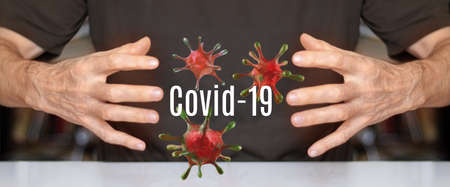 3d image of stylized covid-19 viruses hanging between human hands