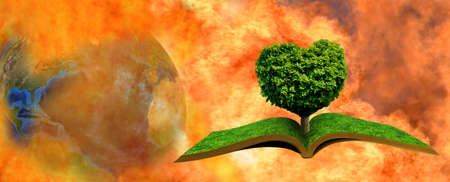 Abstract image of an open book and a tree in the shape of a heart against the background of a flame that engulfed the planet Earthの写真素材