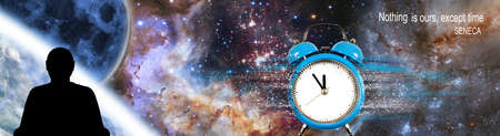 An image of a clock from which particles are separated, a silhouette of a man and the moon close-up on a cosmic background. Quote from Seneca's letters: "There is nothing of ours but time."の写真素材