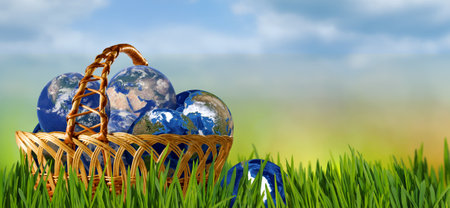 Depicting many globes placed in a basket that stands in the grass. 3D-imageの写真素材