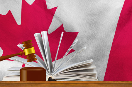 Judicial gavel on the background of an open book and the flag of Canada. 3D imagの写真素材