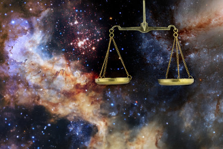 Image of a cup scale against the background of a starry cosmic skyの写真素材