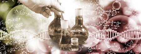 An abstract collage consisting of chemical glassware in the foreground with an experimenter's hand holding a test tube against the background of DNA strands and various mathematical and chemical formulasの写真素材