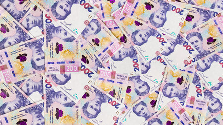 Vibrant currency notes are arranged in a captivating pattern, showcasing their intricate designs and...