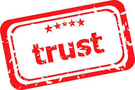 trust red rubber stamp over a white backgroundの写真素材