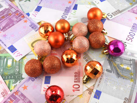 euro notes with christmas balls on itの写真素材