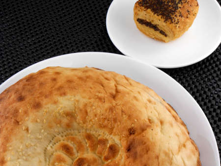 cake and bread on white plate