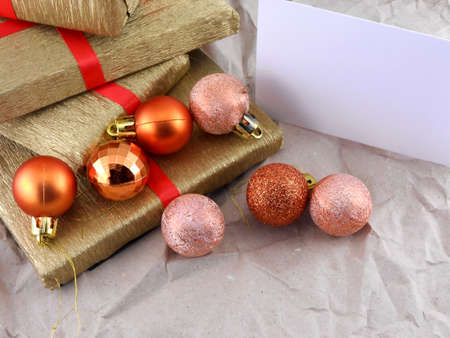 Golden gift box set with red ribbon, christmas balls and empty card