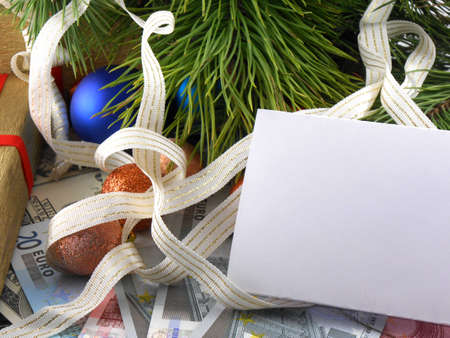 Christmas balls and fir branches with decorations and blank card
