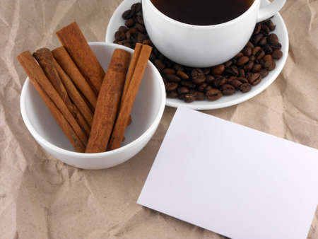 cup of cappuccino with cinnamon and coffee beansの写真素材