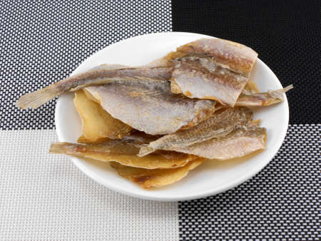 Delicious fish on white plate