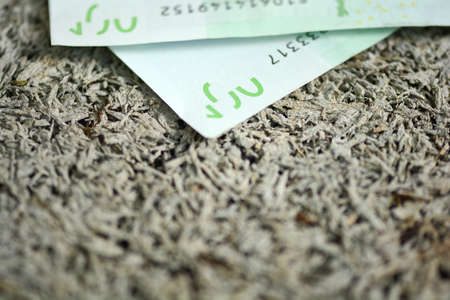 Close-up of  100 Euro banknotes isolated on white background.
