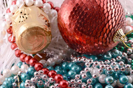 Beautiful ornaments, champagne, pearl and balls as a New Year decorationの写真素材