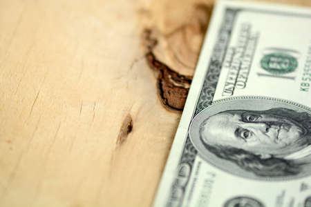 American 100 U.S. dollars on wooden backgroundの写真素材