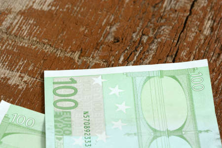Close-up of  100 Euro banknotes isolated on white background.