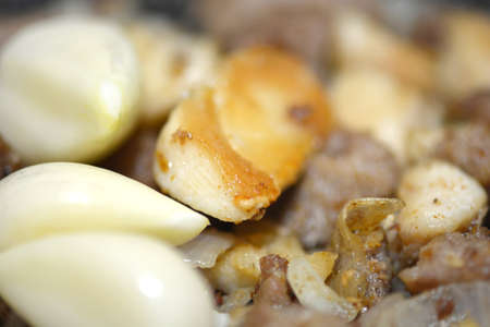 macro food, garlic on fried liverの写真素材