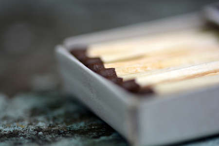 wood match on paper box close up