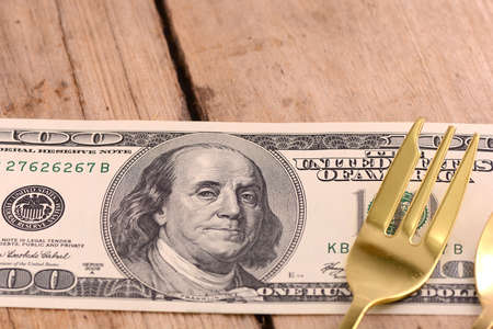 american money on wooden plateの写真素材