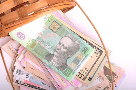 european money on wooden basket, hryvnia, dollars, euroの写真素材