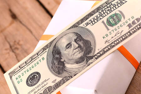 Holiday bonus.  american money on green gift boxの写真素材
