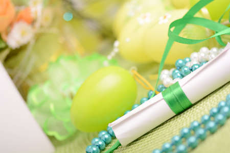 Easter background with eggs, ribbons and spring decoration