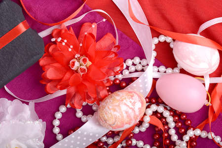 Easter background with eggs, ribbons and spring decorationの写真素材