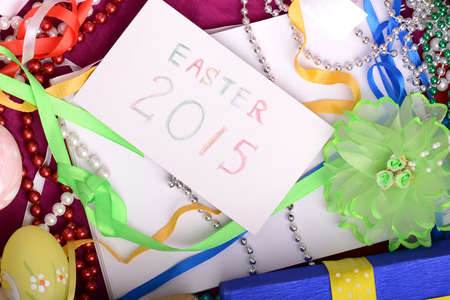 Easter background with eggs, ribbons and spring decoration