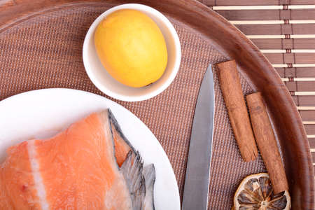 Slice of red fish salmon with fruits and cinnamonの写真素材